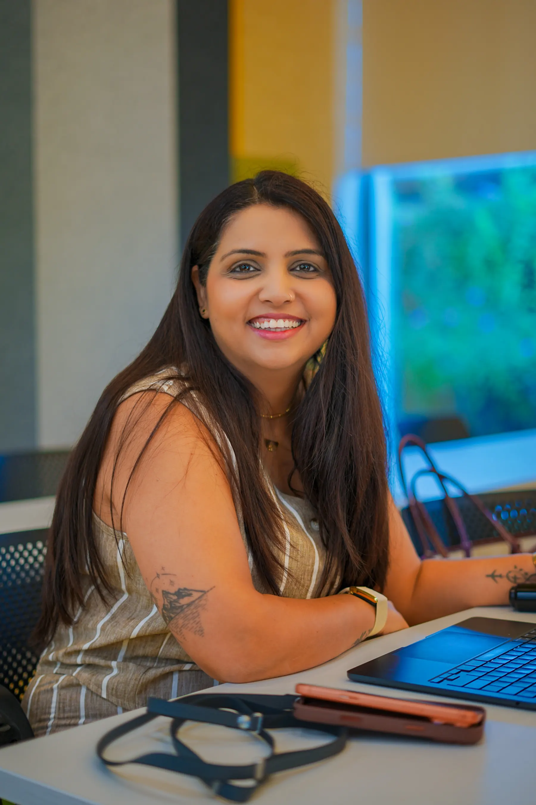 A smiling participant at her laptop