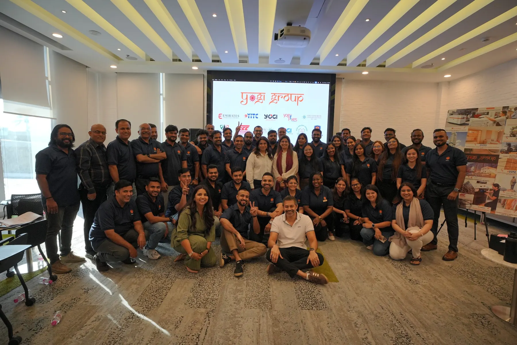 Group photo of around forty managers after a corporate AI workshop